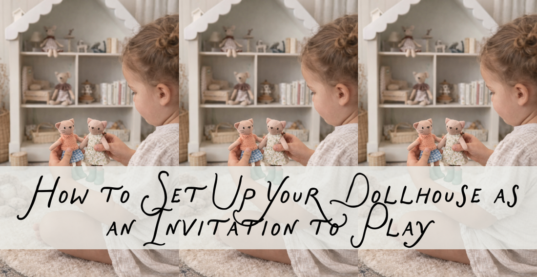 Girl Sitting in front of dollhouse with small cat dolls